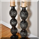 D11. Pair of tall matching pierced metal candleholders. 32&rdquo;h 
